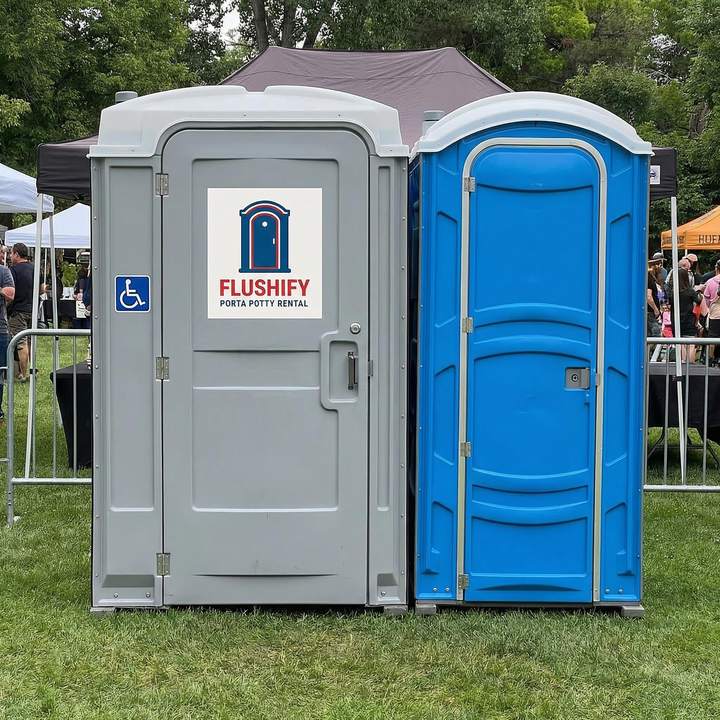 Grey ADA accessible unit next to a blue standard portable toilet
