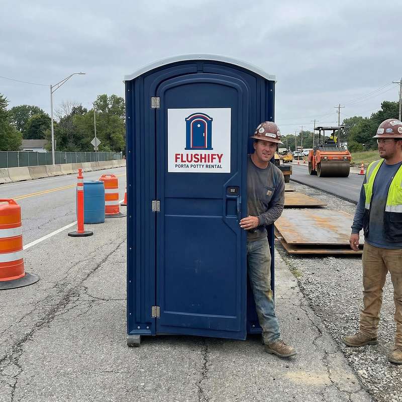 Navy portable toilet with a road crew at a paving job